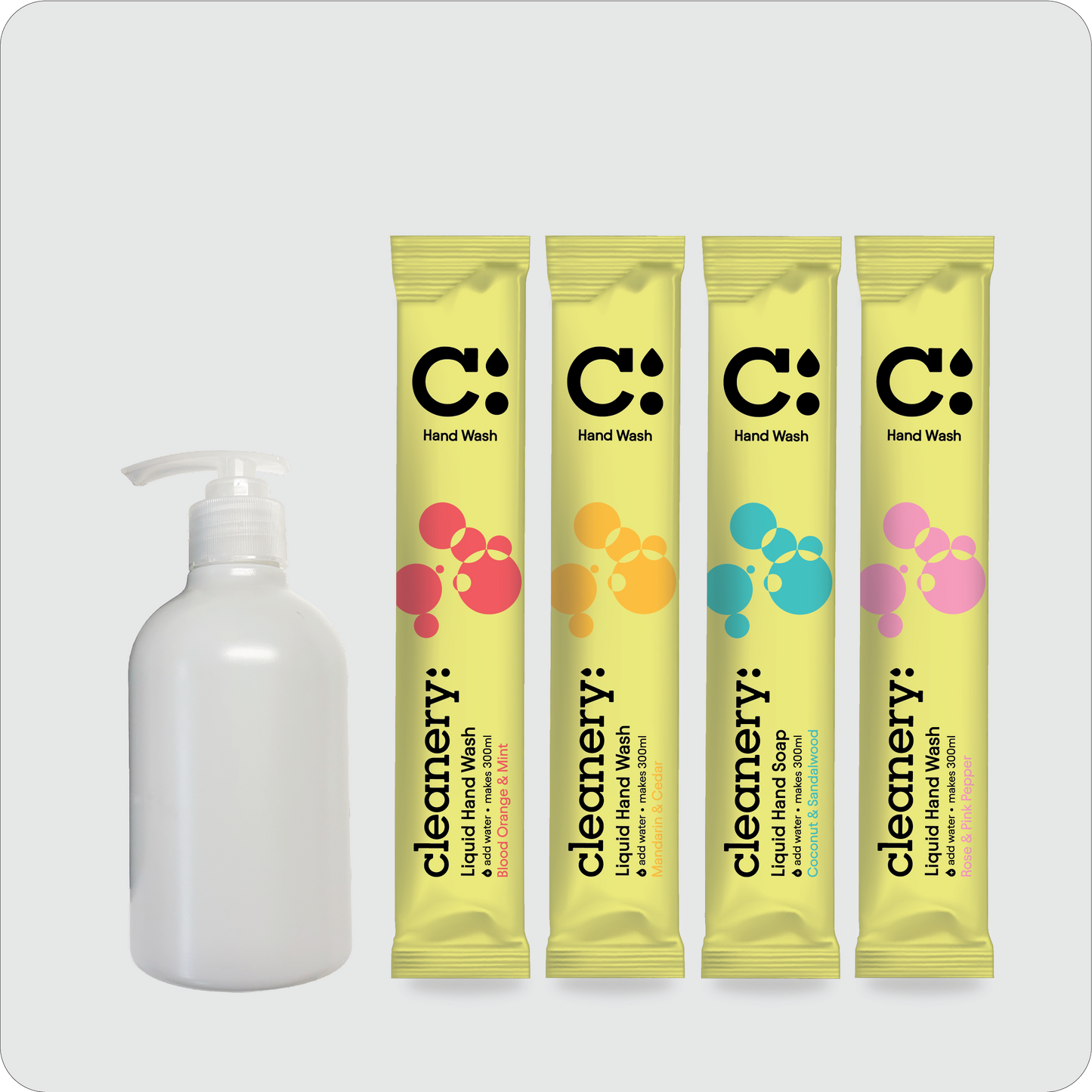 A set of four yellow single-use liquid hand wash sachets with colorful bubble graphics and a white pump bottle of hand wash, arranged on a light gray background. The brand name 'cleanery:' is visible on the sachets.